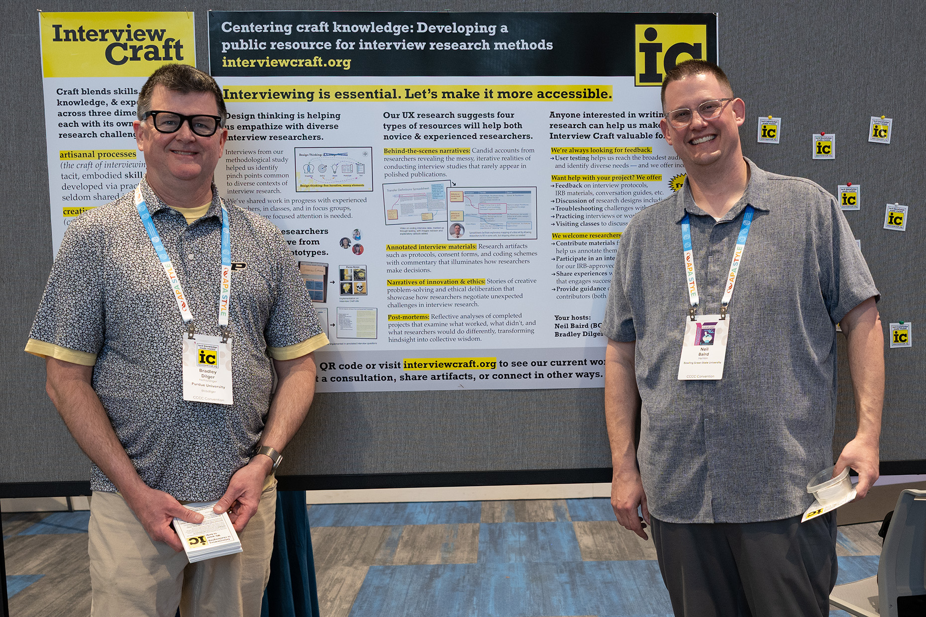 Both presenters in front of their research poster.